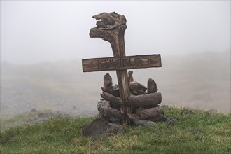 Signpost, driftwood, Kuvikur, Reykjarfjoerour, Strandir, Arnes, Westfjords, Iceland, Europe