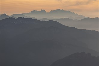 Silhouette of a mountain peak in the evening light, haze, backlight, autumn, view from the