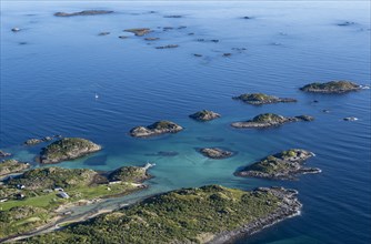 Coast and rocky islands in the blue sea, sea with archipelago islands, Ulvagsundet, Vesteralen,
