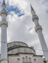 Two conical minarets of mosque located in Istanbul, Turkiye