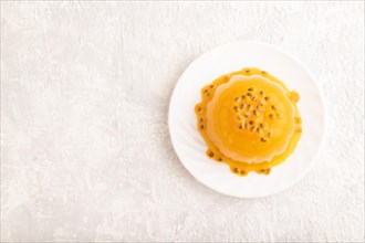 Mango and passion fruit jelly on gray concrete background. top view, flat lay, copy space