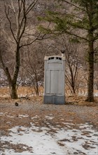 Old fashioned port-a-potty in use as public toilet in wilderness in South Korea