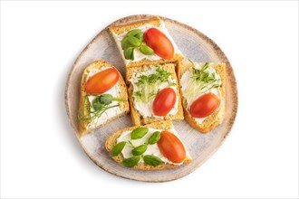 White bread sandwiches with cream cheese, tomatoes and microgreen isolated on white background. top