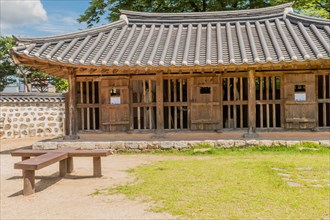 Old jailhouse with tiled roof located in historic park in South Korea
