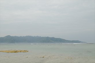 Lombok and Gili Air islands, overcast, cloudy day, sky and sea. Vacation, travel, tropics concept,