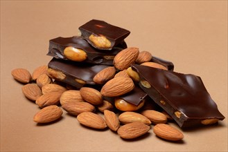Chocolate with almonds and a bunch of almonds, Prunus dulcis