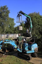 Delivery and installation of concrete ring for domestic septic tank system, Suffolk, England, UK