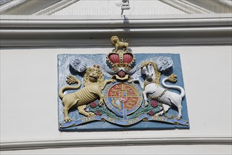 Lion and unicorn royal coat of arms 'Dieu et mon Droit' motto of monarchy seen in Falmouth,
