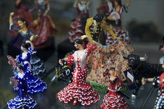 Souvenir gift model figures in shop window display, Benidorm, Spain flamenco dancers bull fighting,