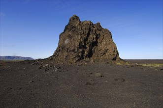 Large basalt crag or pinnacle on a cinder plain to the east of the town of Vik, southern Iceland