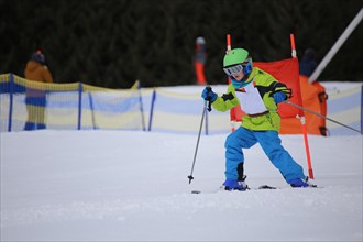 Child at a guest ski race in a ski resort