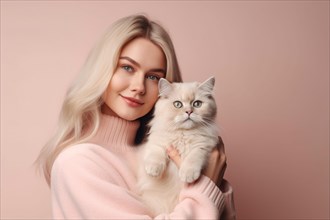 Young woman holding cat in front of studio background. KI generiert, generiert AI generated