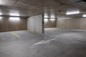 Illuminated Underground Parking Lot with Number and Arrow in Switzerland