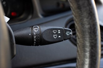Windscreen wiper control adjustment lever switch in a modern car, car interior