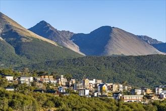 Houses in the city of Ushuaia against the backdrop of the mountains of Tierra del Fuego, Tierra del