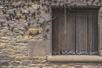 Window detail in Rupit, one of the best known medieval towns in Catalonia in Spain