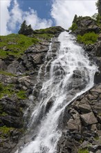 Cascades of a majestic waterfall in a green mountain landscape, Capra Waterfall, Goat Waterfall,