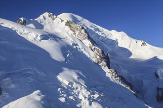 Mountain peak with glacier at sunrise, Mont Blanc, Mont Blanc Massif, French Alps, Chamonix,