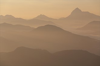 Mountain peak in the haze, sunrise, summer, view from Jochberg to Guffert and Bavarian Alps, Upper