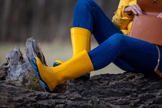 Woman with yellow wellies