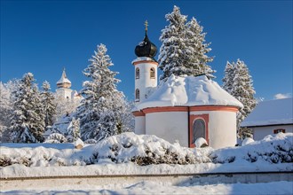 Winter atmosphere with snow-covered small chapel at Schlehdorf Monastery, Schlehdorf, Lake Kochel,