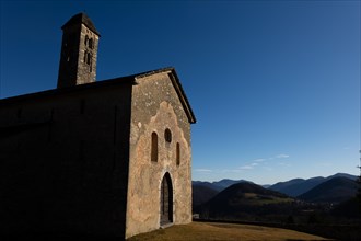 Beautiful Old Church with Mountain Range View with Sky and Sunlight in Malcantone, Miglieglia,