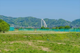 Landscape of rural park with bridge arch in background