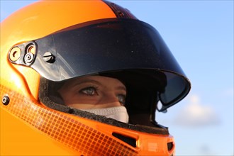 Racer with helmet and balaclava