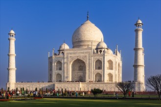 The imposing Taj Mahal surrounded by crowds under a clear sky during the day, Taj Mahal, Agra,