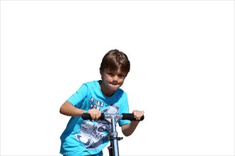 Boy on a scooter in front of a white background