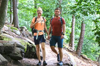 Symbolic image: Young couple hiking in the Palatinate Forest, here on the fifth stage of the