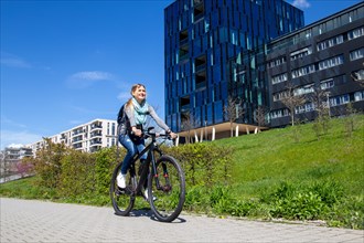 Young woman travelling by bike in Karlsruhe