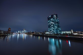The lights of the European Central Bank (ECB) in Frankfurt am Main shine in the evening, Osthafen,