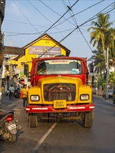 A colorful old Tata cargo truck navigates the streets of Fort Kochi, Cochin, Kerala, India, Asia