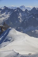 Climber on glacier in front of mountains, group, Mont Blanc massif, Chamonix, French Alps, France,