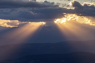 Thunderstorm mood over mountains, backlight, sunbeams, summer, view from Schlern to Sarntaler Al,