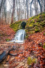 Waterfall in the Rautal forest in Jena in winter, Jena, Thuringia, Germany, Europe