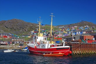 Colourful houses, fishing boat in the harbour, Qaqortoq, Greenland, Denmark, North America