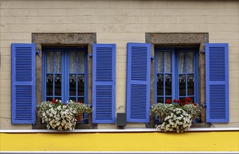 House facade with two windows, blue window frames and blue shutters, Roscoff, Bretagne, France,