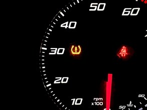 Car dashboard panel with light signal the belt is not fastened and the tire pressure is low. car