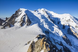 Mountain peak with glacier in sunshine, view from Aiguille du Midi to Mont Blanc, Mont Blanc
