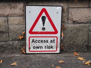Access at own risk sign