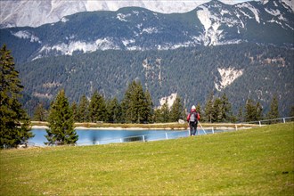 Woman hiking at the Kaltwassersee lake in Seefeld, Tyrol