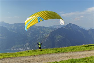 Paragliders on the Niederbauen with a view of the Rigi, Lake Lucerne, Canton Uri, Switzerland, Lake