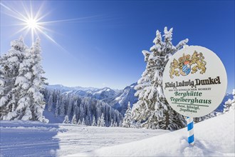Ski slope in front of mountain landscape, Tegelberghaus sign, winter, sun star, Tegelberg, Ammergau