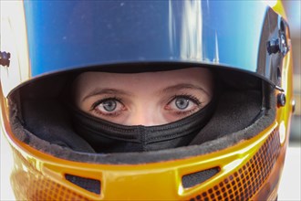 Symbolic image: Racer with helmet and balaclava