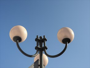 Street lamp over blue sky