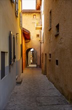 Old Narrow City Street with Sunlight in Agnuzzo, Ticino, Switzerland, Europe