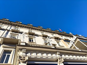Beautiful Facade of an Old Building Against Blue Clear Sky in a Sunny Day in Switzerland
