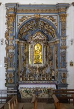 Ornately decorated statue Blessed Virgin Mary and baby Jesus church of Igreja de Santiago, Tavira,